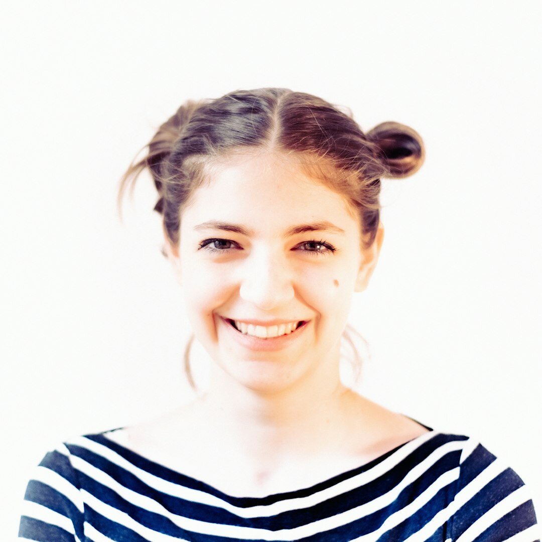 Professional woman with light brown hair and warm smile