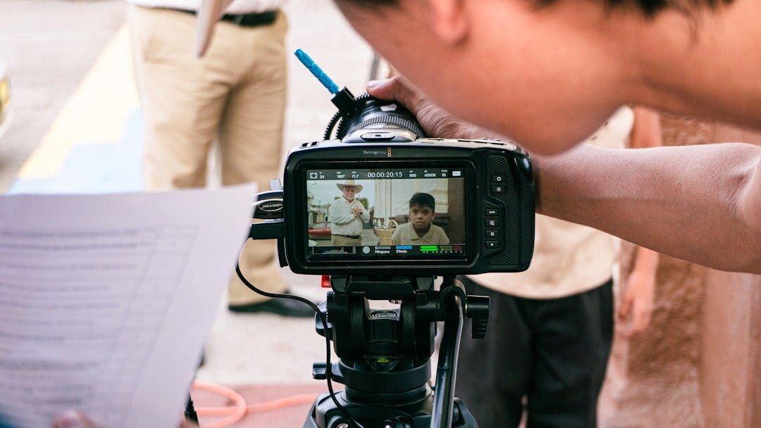 Person recording an educational tutorial video with professional camera setup